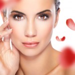 woman and red rose petals