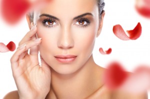 woman and red rose petals